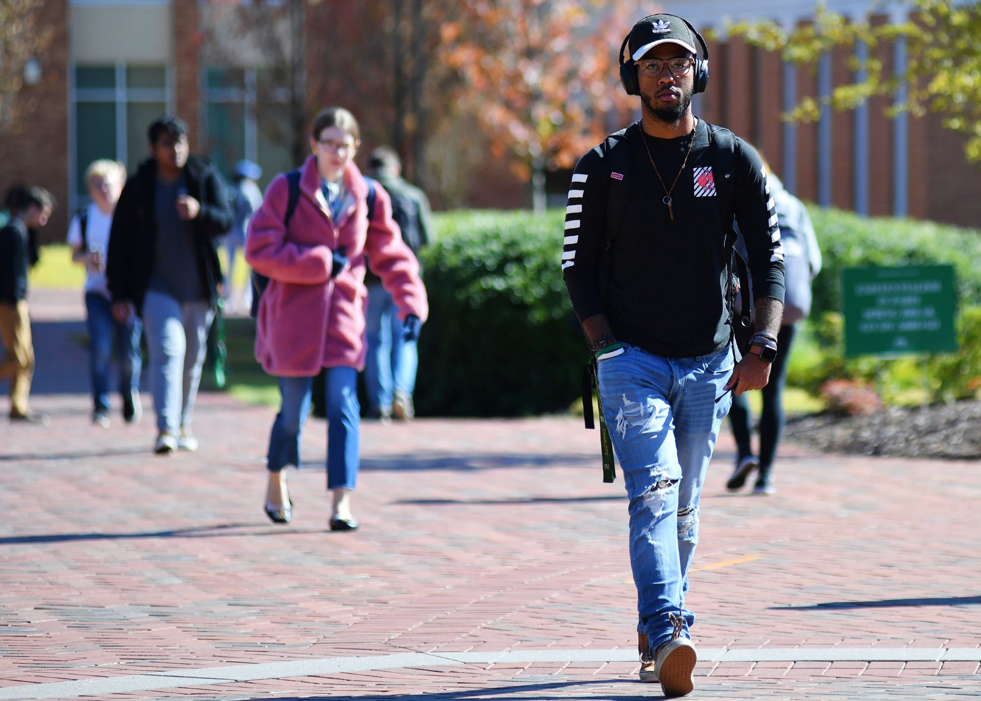 Students walking on campus in fall